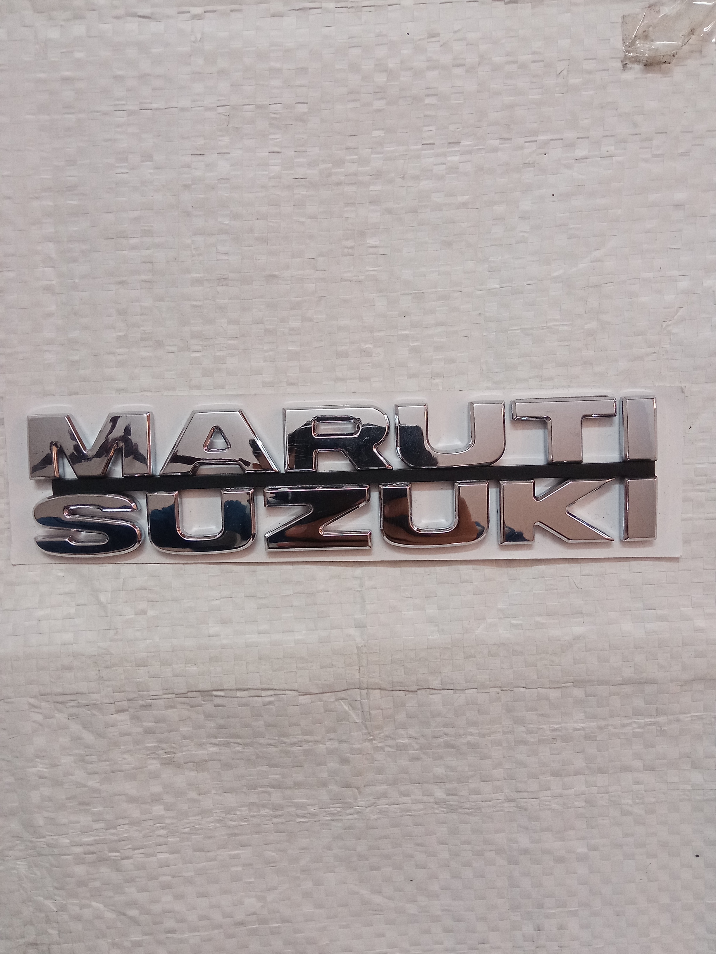 SUZUKI SWIFT EMBLEM MARUTI SUZUKI           77821M79F00      STOCKID 1770